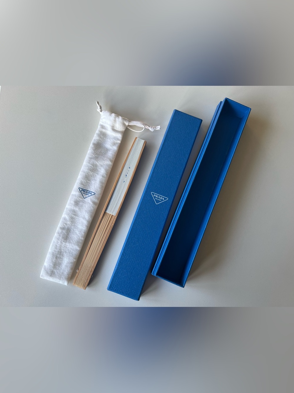 Prada Blue Folding Hand Fan with Natural Wood Frame